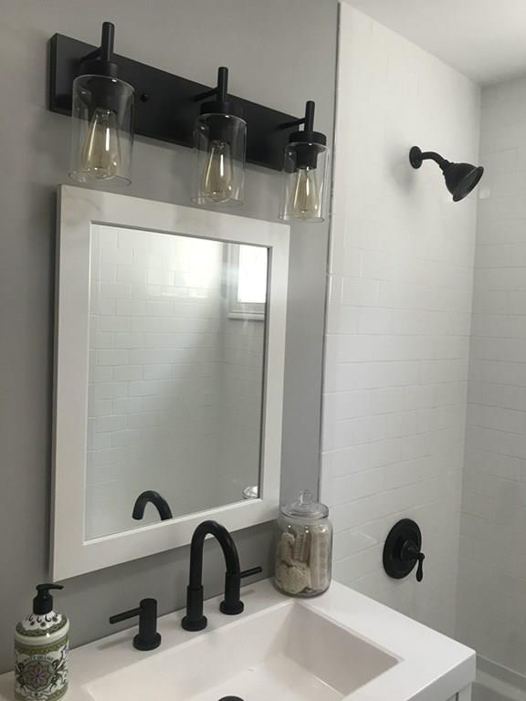 33 Surrey Road Springfield, MA 01118 - Photo 9 of 22 a bathroom with a sink and a mirror