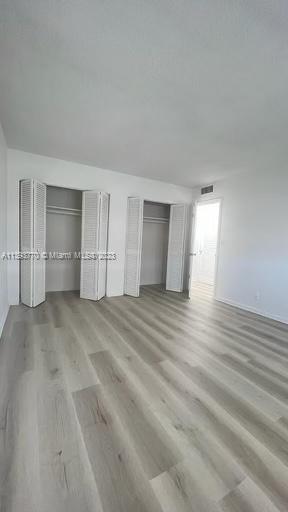 5300 Washington Street, Unit G324 Hollywood, FL 33021 - Photo 4 of 7 a view of empty room with wooden floor
