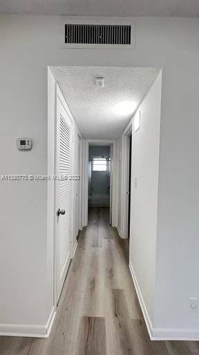 5300 Washington Street, Unit G324 Hollywood, FL 33021 - Photo 6 of 7 a view of a hallway with wooden floor