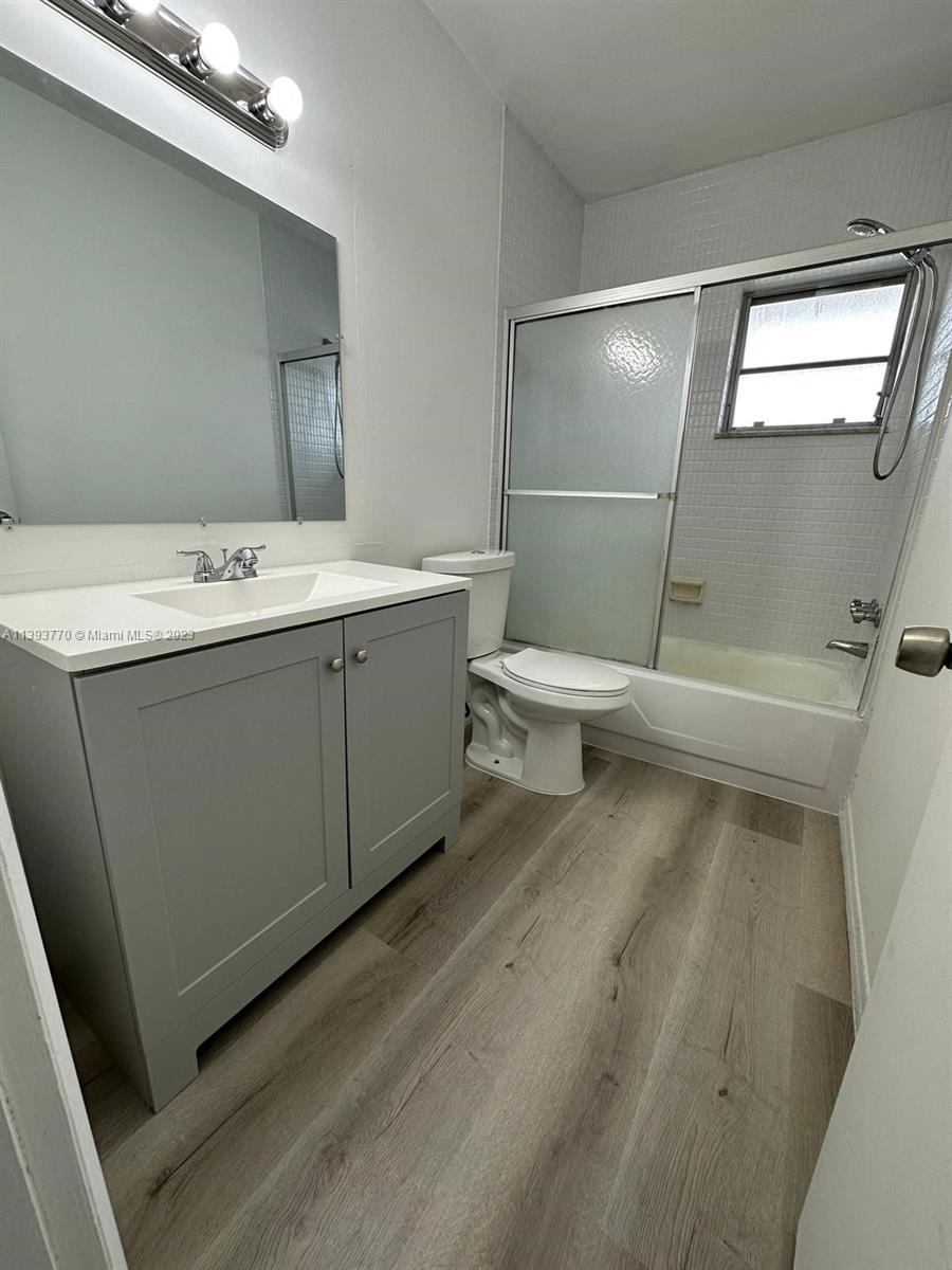 5300 Washington Street, Unit G324 Hollywood, FL 33021 - Photo 7 of 7 a bathroom with a sink a toilet and a shower