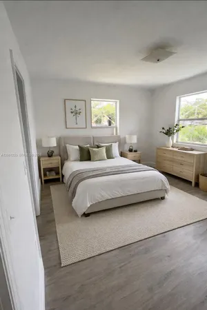 a view of a kitchen with granite countertop white cabinets and white appliances