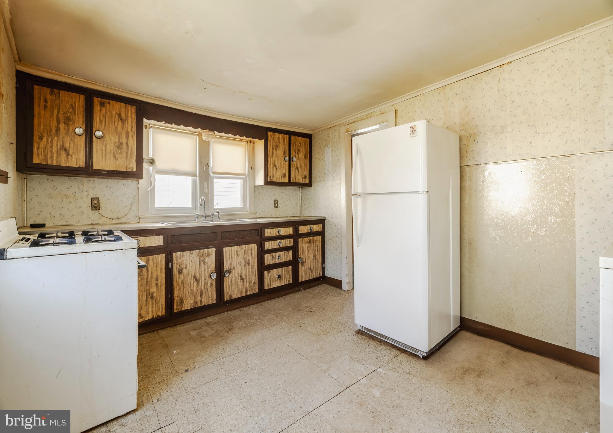 228 Rancocas Avenue Delanco, NJ 08075 - Photo 11 of 14 a kitchen with stainless steel appliances a refrigerator sink and cabinets