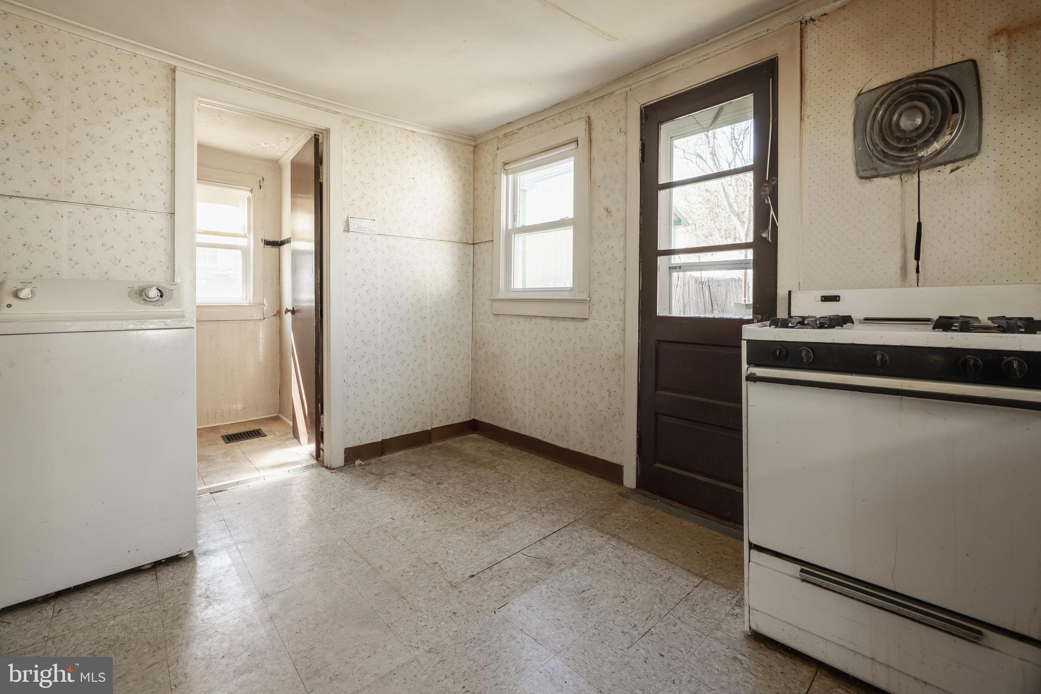 228 Rancocas Avenue Delanco, NJ 08075 - Photo 13 of 14 a view of a kitchen with fridge and wooden floor