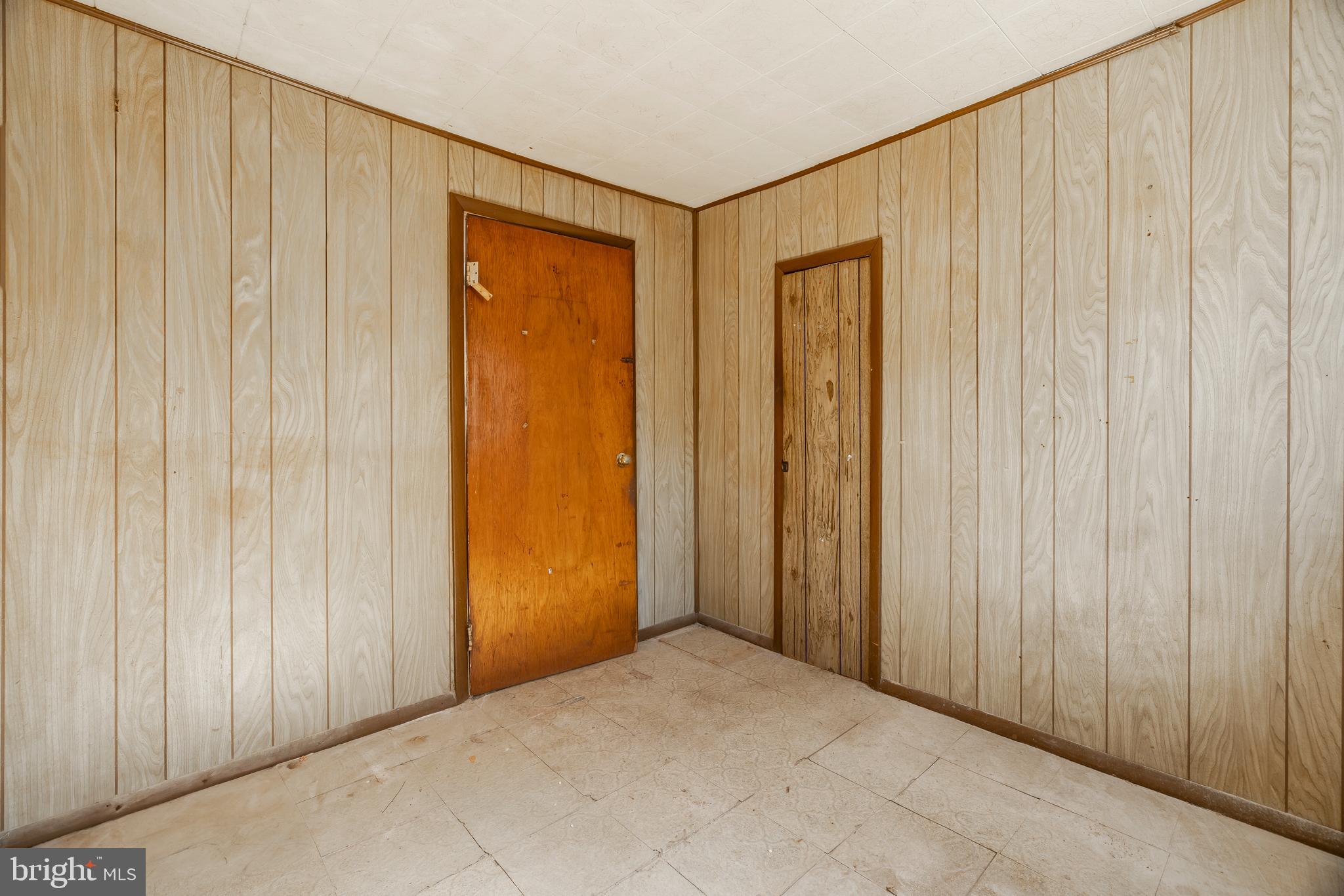 228 Rancocas Avenue Delanco, NJ 08075 - Photo 10 of 14 a view of an empty room with wooden walls