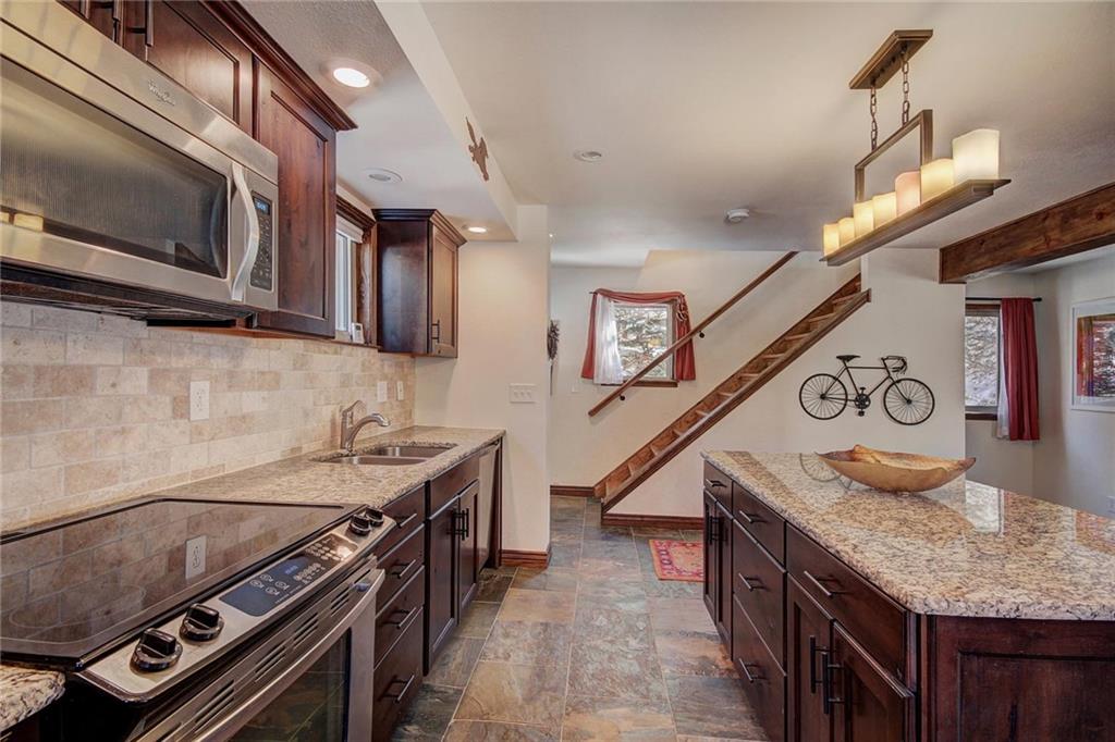 187 Rasor Drive Keystone, CO 80435 - Photo 12 of 24 a kitchen with a stove and a microwave