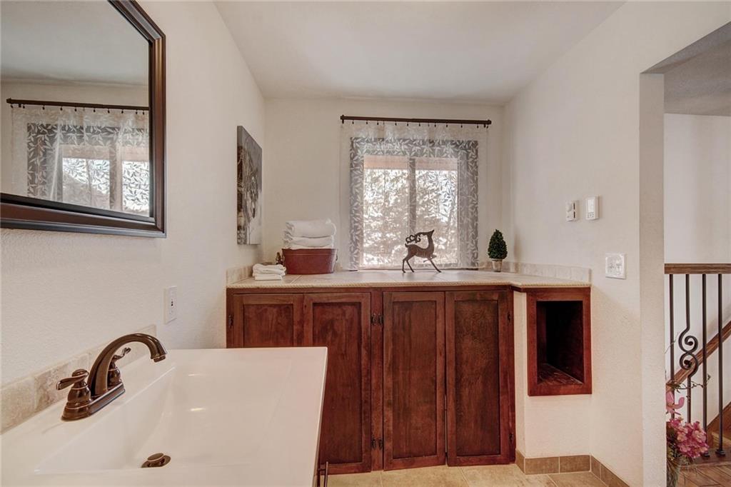 187 Rasor Drive Keystone, CO 80435 - Photo 19 of 24 a bathroom with a sink and a window