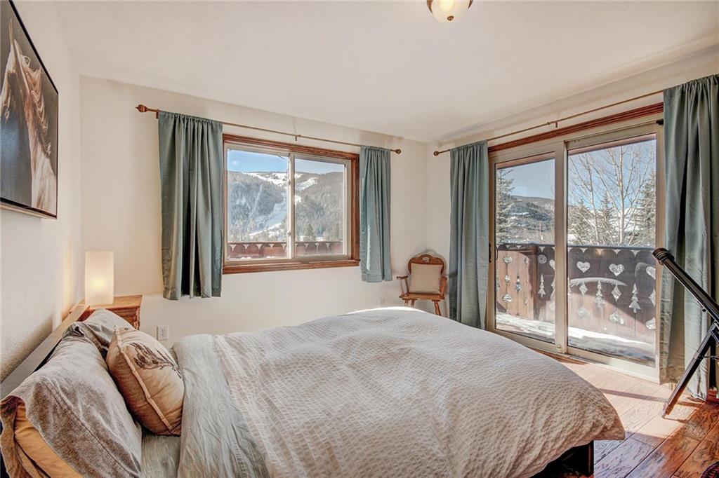 187 Rasor Drive Keystone, CO 80435 - Photo 21 of 24 a bedroom with a large bed and a large window with outer view