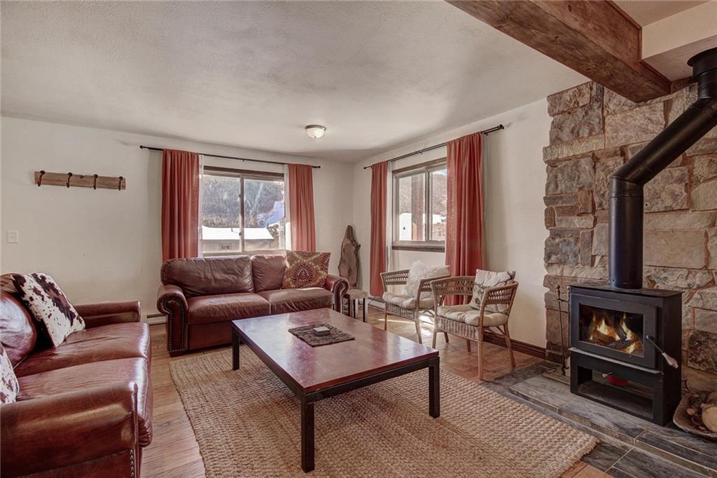 187 Rasor Drive Keystone, CO 80435 - Photo 8 of 24 a living room with furniture and a fireplace