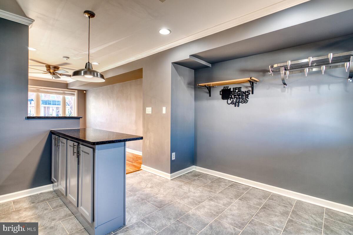 340 Gusryan Street Baltimore, MD 21224 - Photo 11 of 34 a view of a hallway with a chandelier