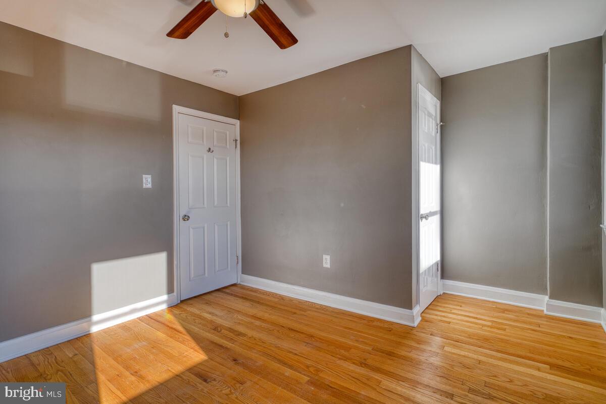 340 Gusryan Street Baltimore, MD 21224 - Photo 17 of 34 a view of empty room with wooden floor