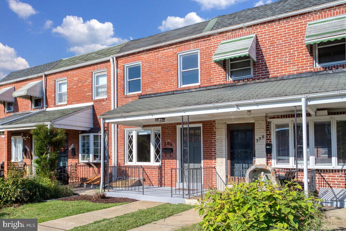 340 Gusryan Street Baltimore, MD 21224 - Photo 2 of 34 a front view of a house with garden