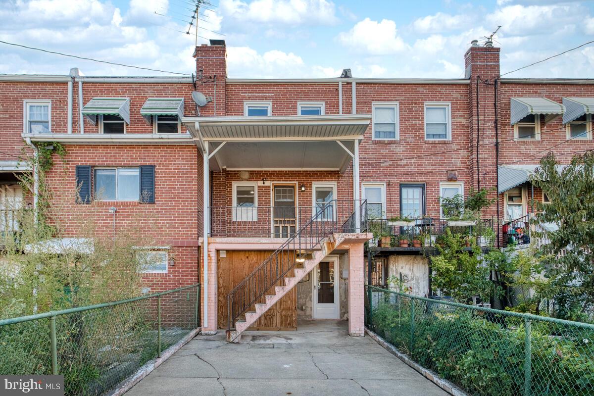 340 Gusryan Street Baltimore, MD 21224 - Photo 29 of 34 a front view of a house with iron fence