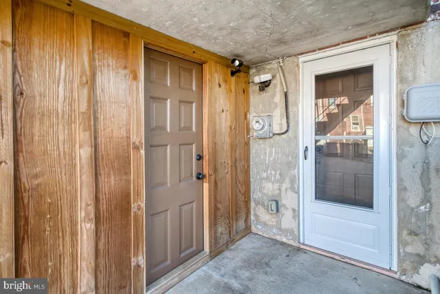 a view of a bathroom from a glass door