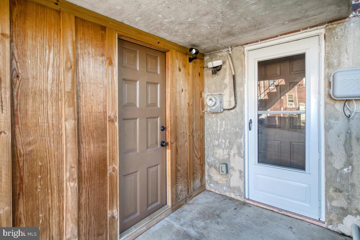 340 Gusryan Street Baltimore, MD 21224 - Photo 30 of 34 a view of a bathroom from a glass door