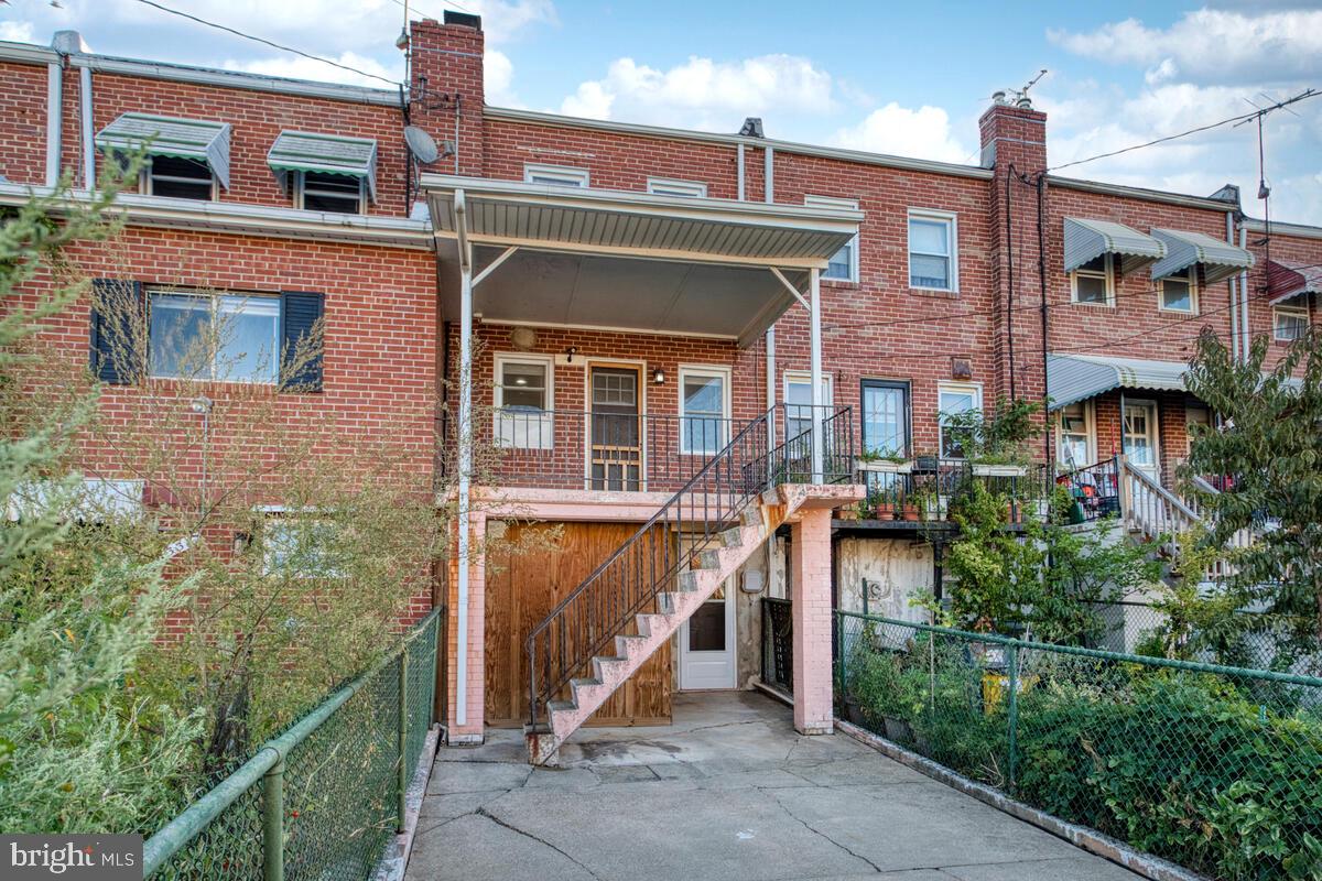 340 Gusryan Street Baltimore, MD 21224 - Photo 32 of 34 a front view of a house with a yard