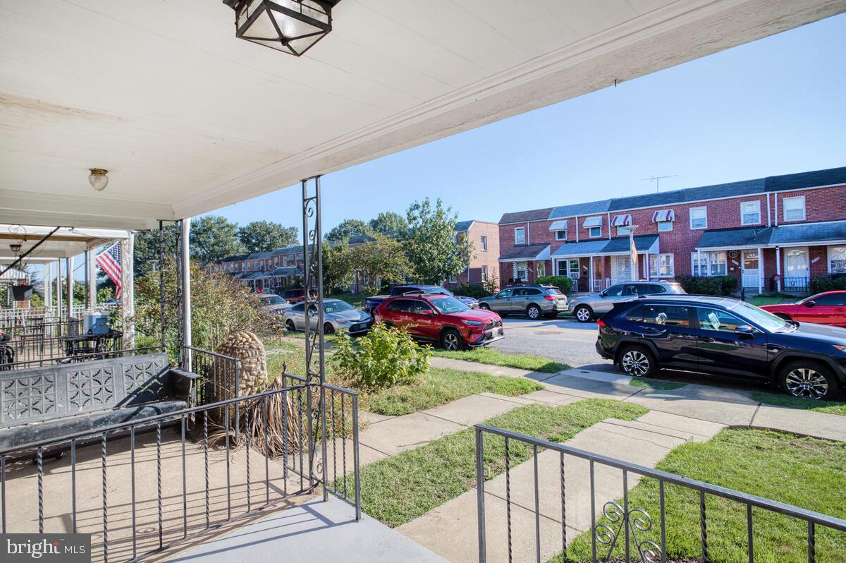 340 Gusryan Street Baltimore, MD 21224 - Photo 4 of 34 a view of cars parked in front of a house