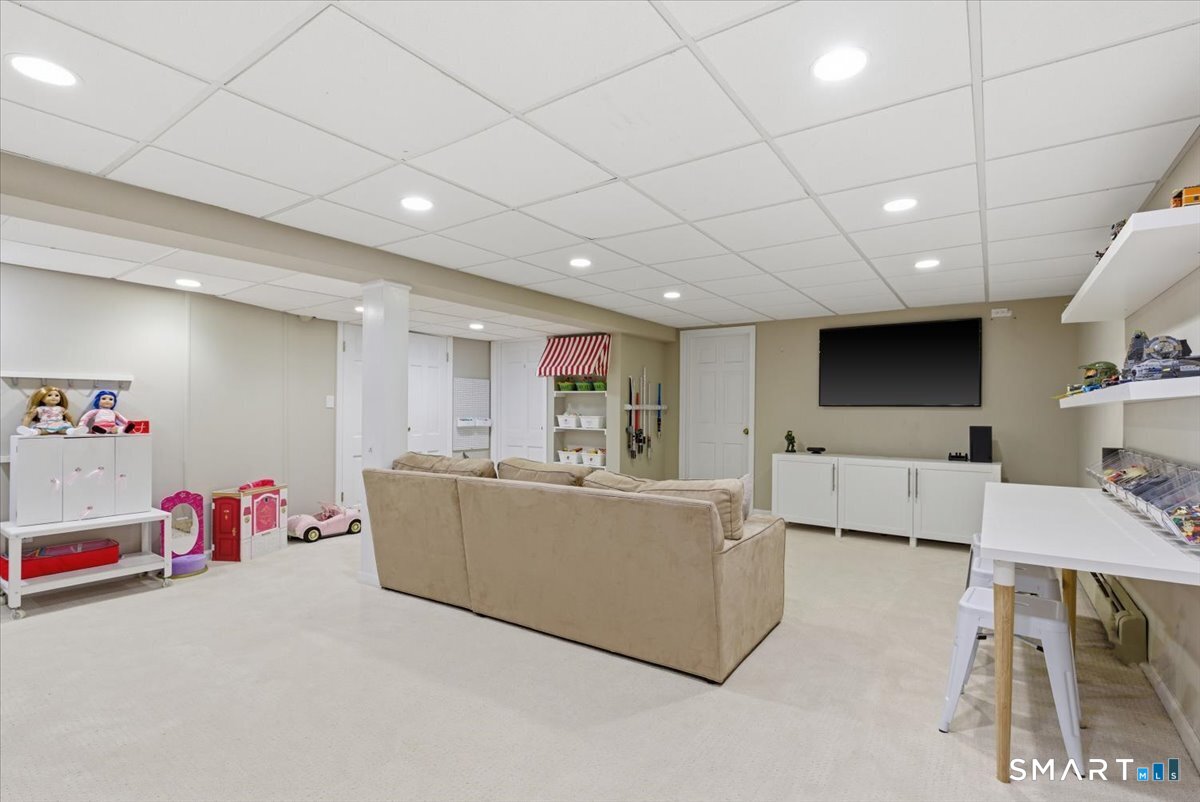 599 North Wilton Road New Canaan, CT 06840 - Photo 30 of 37 Lower level playroom area w/ half bathroom