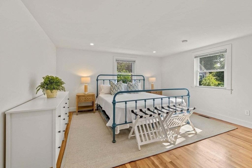 72 Forest Beach Road Chatham, MA 02659 - Photo 13 of 32 a bedroom with furniture and a wooden floor