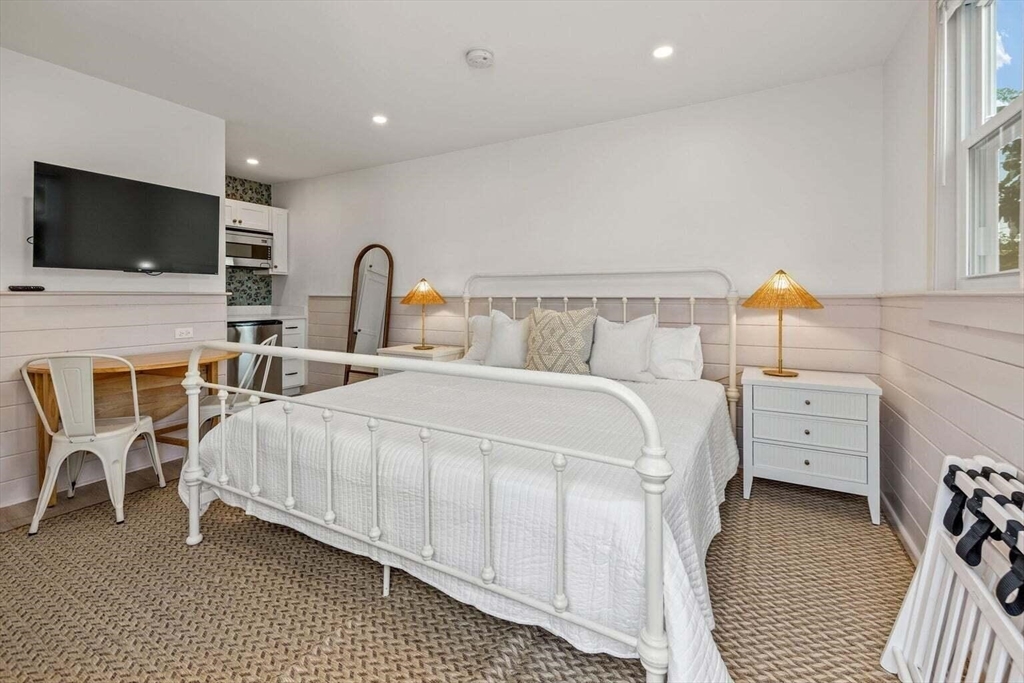 72 Forest Beach Road Chatham, MA 02659 - Photo 21 of 32 a bed room with furniture and a flat screen tv