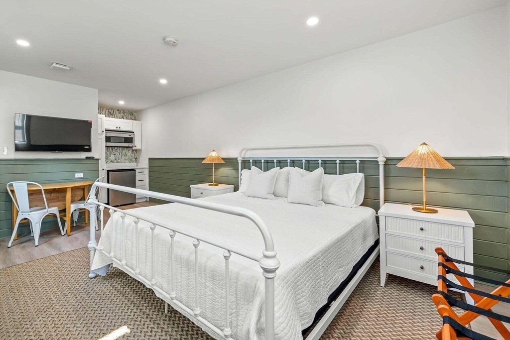 72 Forest Beach Road Chatham, MA 02659 - Photo 25 of 32 a bedroom with a bed and a flat screen tv