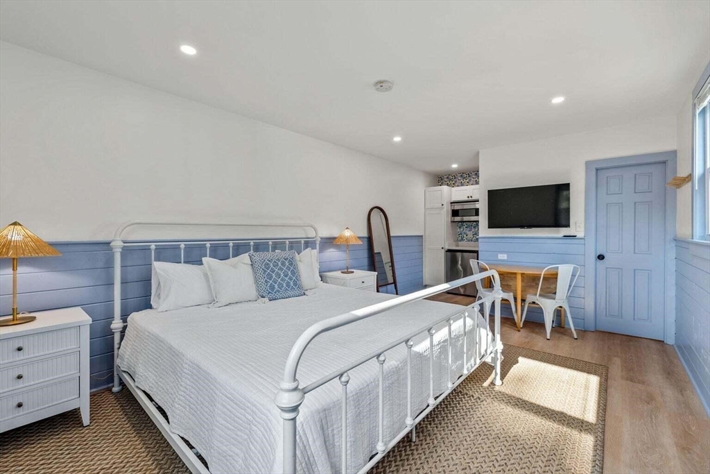 72 Forest Beach Road Chatham, MA 02659 - Photo 28 of 32 a bed room with a bed and a television