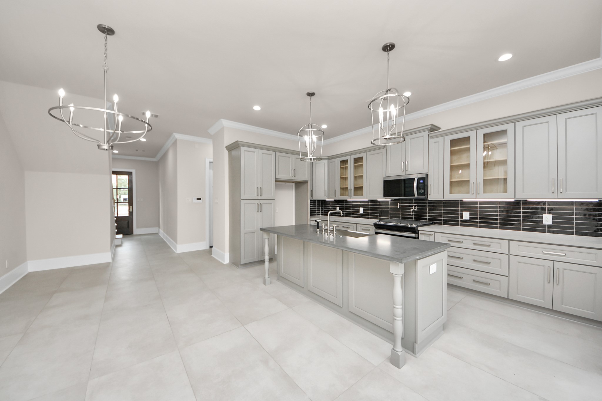 6320 Milwee Street, Unit B Houston, TX 77092 - Photo 14 of 43 a large kitchen with granite countertop a large counter top appliances and cabinets