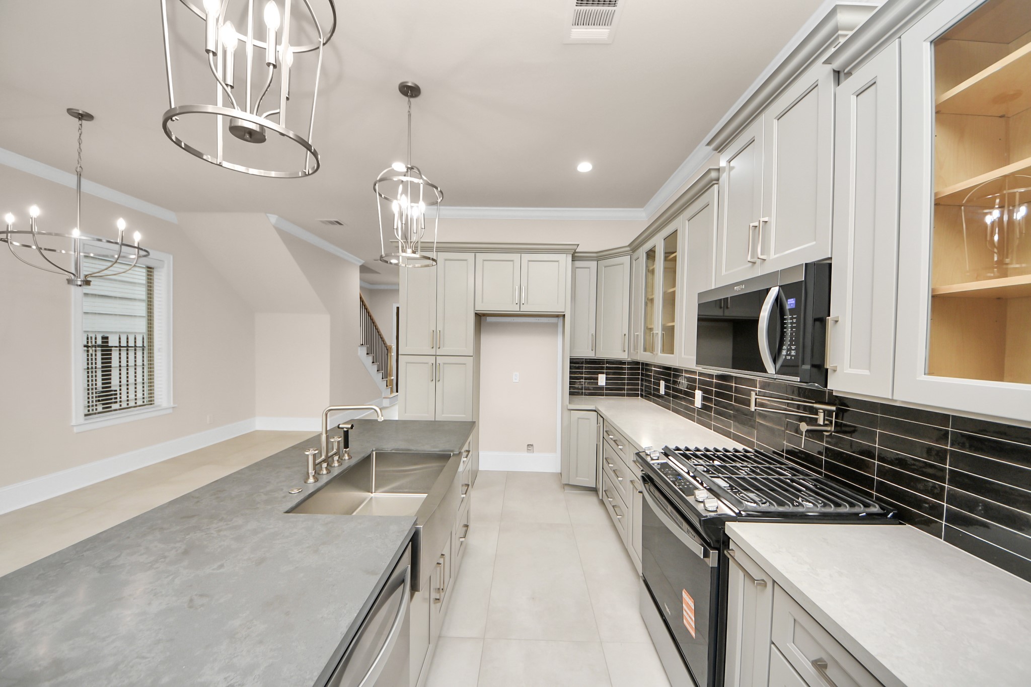 6320 Milwee Street, Unit B Houston, TX 77092 - Photo 16 of 43 a kitchen with stainless steel appliances granite countertop a sink stove and refrigerator