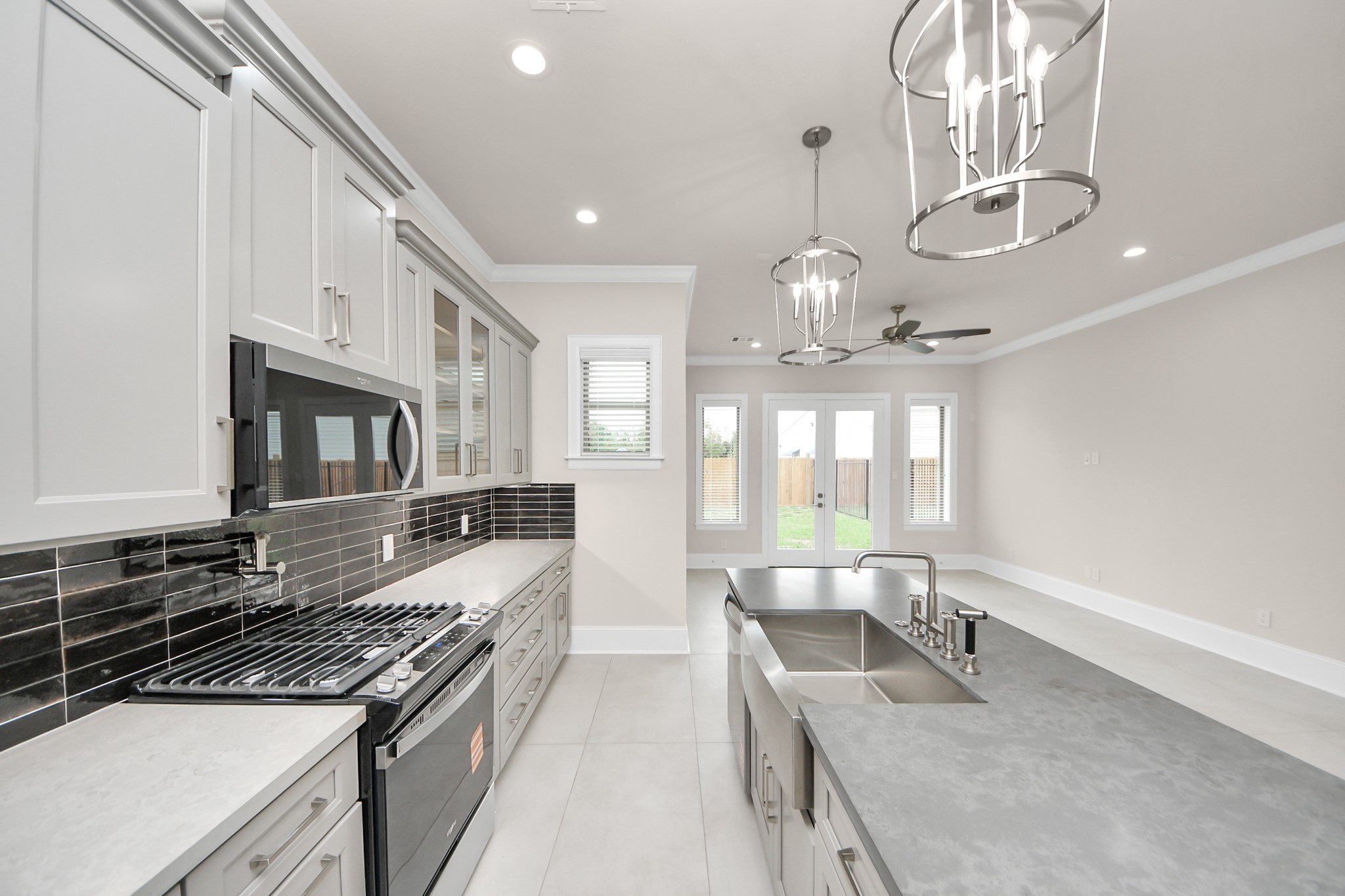 6320 Milwee Street, Unit B Houston, TX 77092 - Photo 18 of 43 a large kitchen with stainless steel appliances granite countertop a stove and a sink with granite countertops