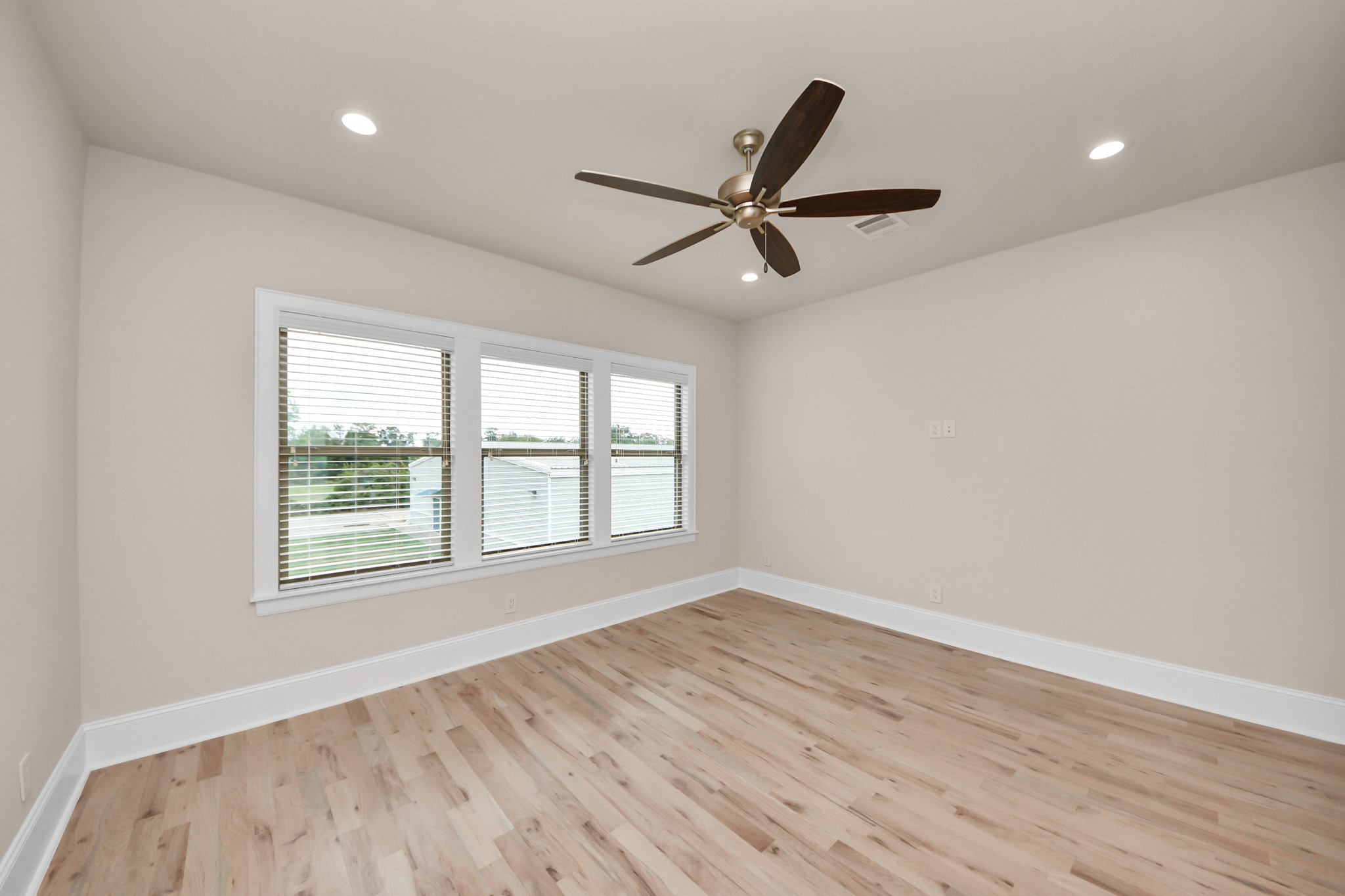 6320 Milwee Street, Unit B Houston, TX 77092 - Photo 25 of 43 wooden floor in an empty room with a window