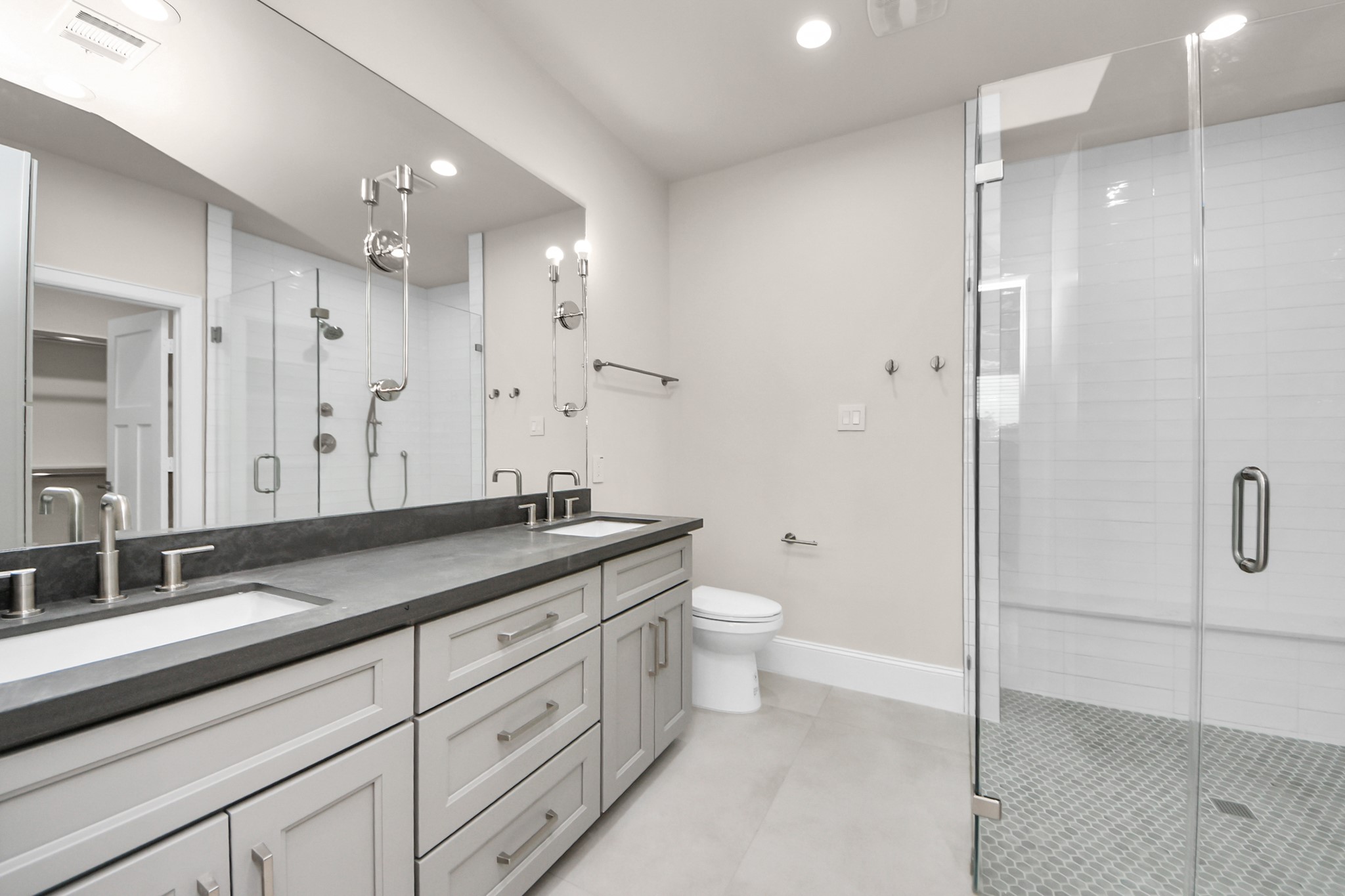 6320 Milwee Street, Unit B Houston, TX 77092 - Photo 27 of 43 a bathroom with a granite countertop sink a toilet and shower