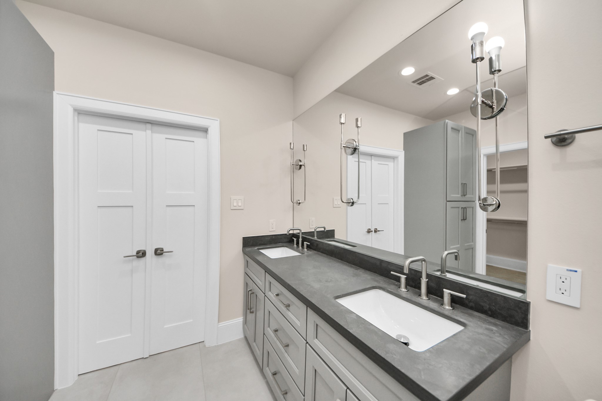 6320 Milwee Street, Unit B Houston, TX 77092 - Photo 31 of 43 a bathroom with a granite countertop double vanity sink a mirror and shower