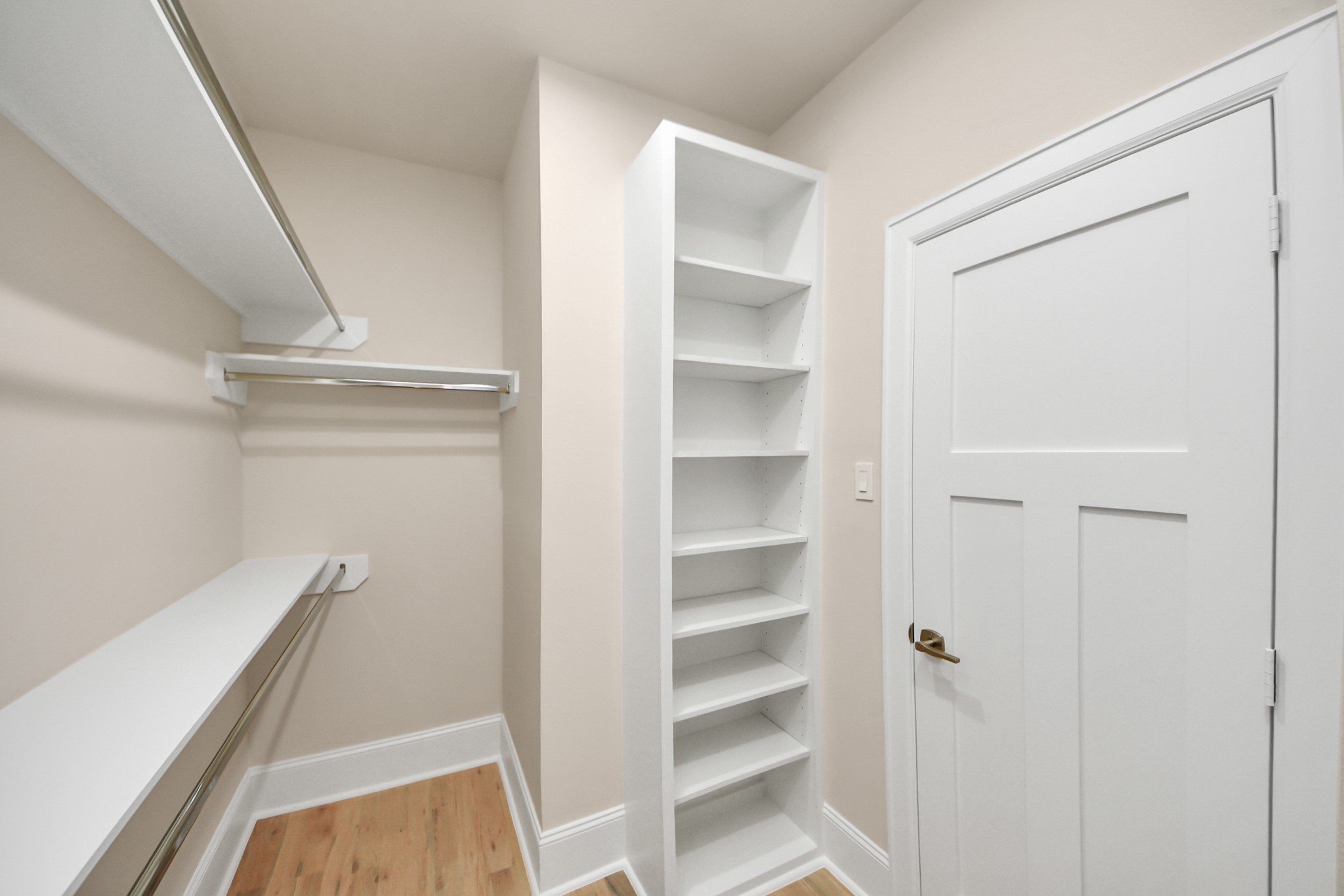 6320 Milwee Street, Unit B Houston, TX 77092 - Photo 33 of 43 a view of closet area with empty racks