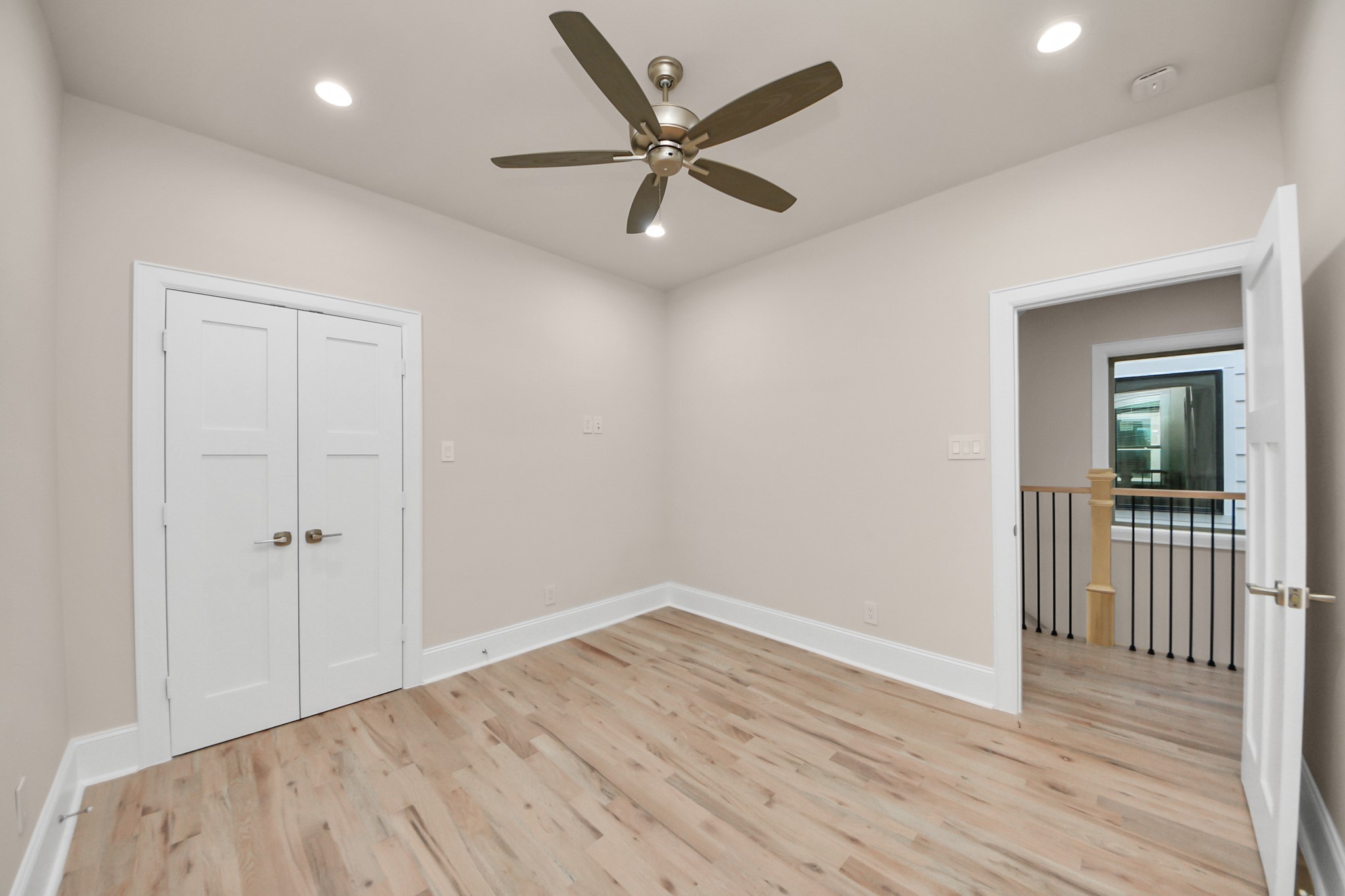 6320 Milwee Street, Unit B Houston, TX 77092 - Photo 35 of 43 wooden floor in an empty room with a window