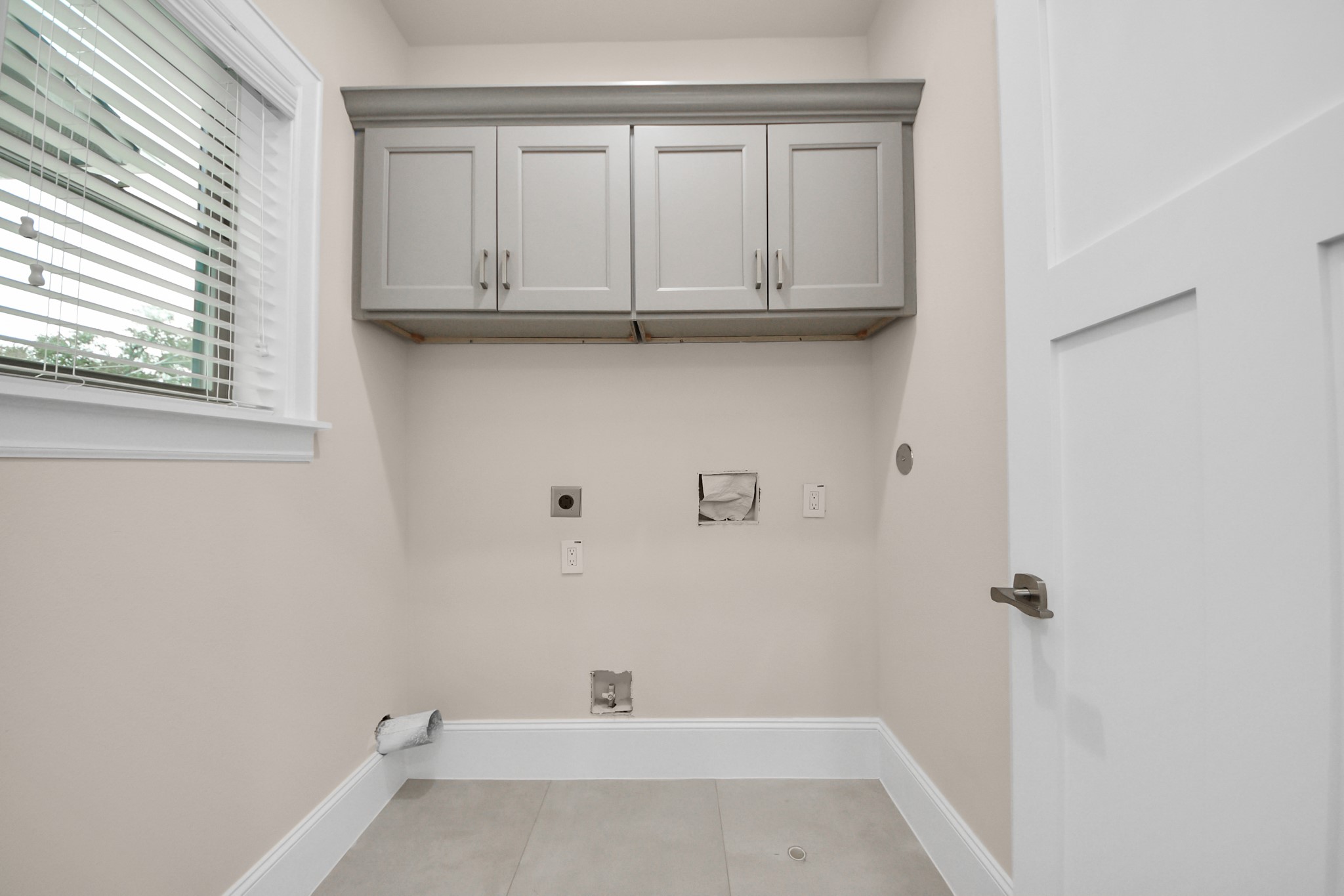 6320 Milwee Street, Unit B Houston, TX 77092 - Photo 36 of 43 a view of a kitchen with white cabinets