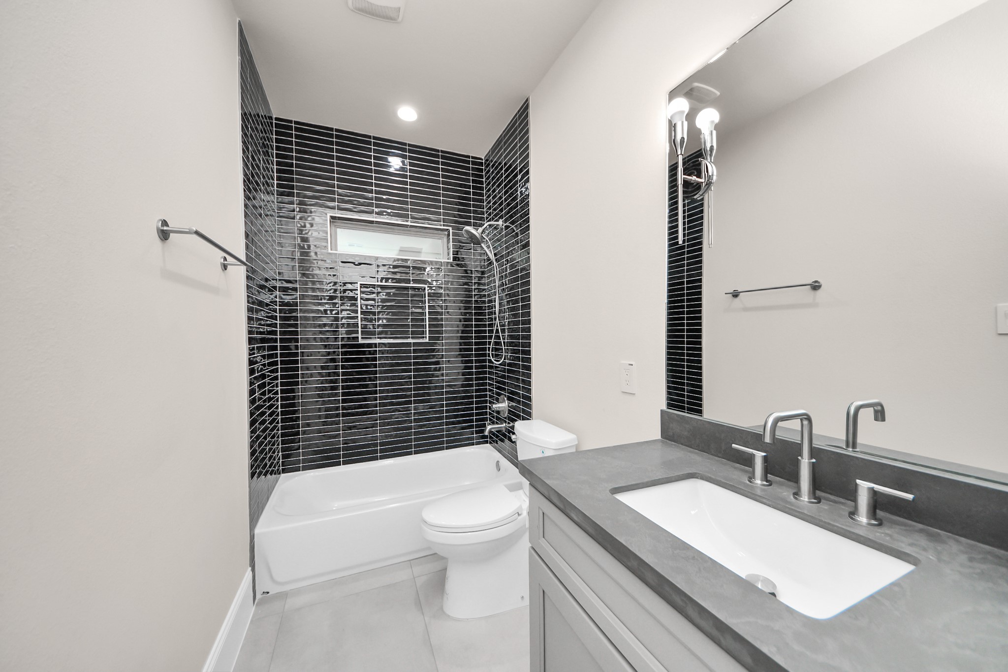 6320 Milwee Street, Unit B Houston, TX 77092 - Photo 37 of 43 a bathroom with a sink a toilet and shower