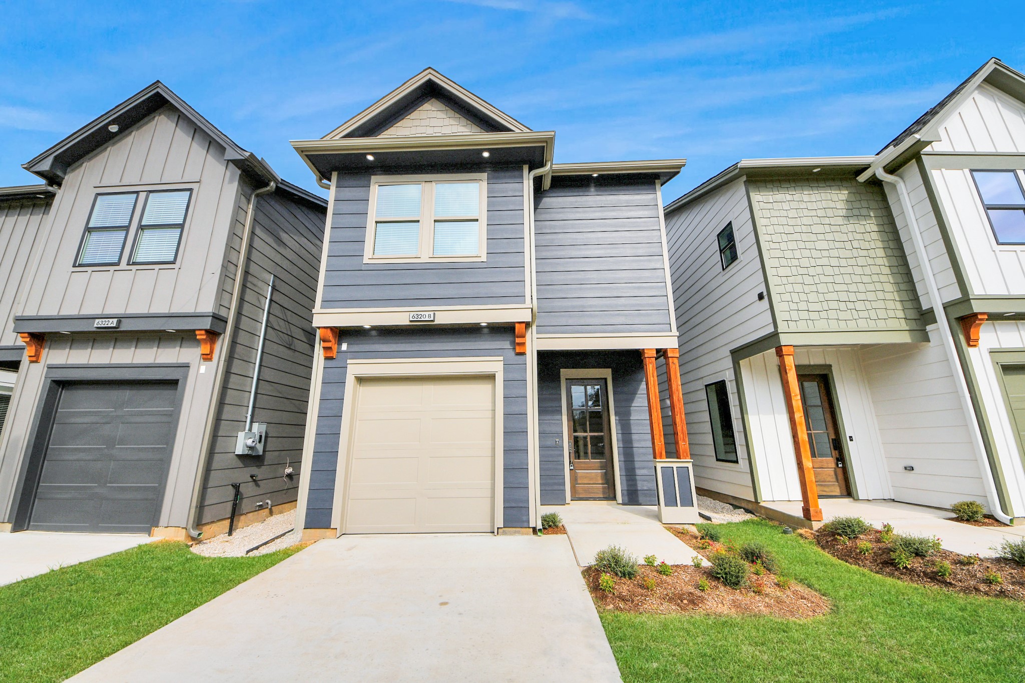 6320 Milwee Street, Unit B Houston, TX 77092 - Photo 4 of 43 a front view of a house with a yard and garage