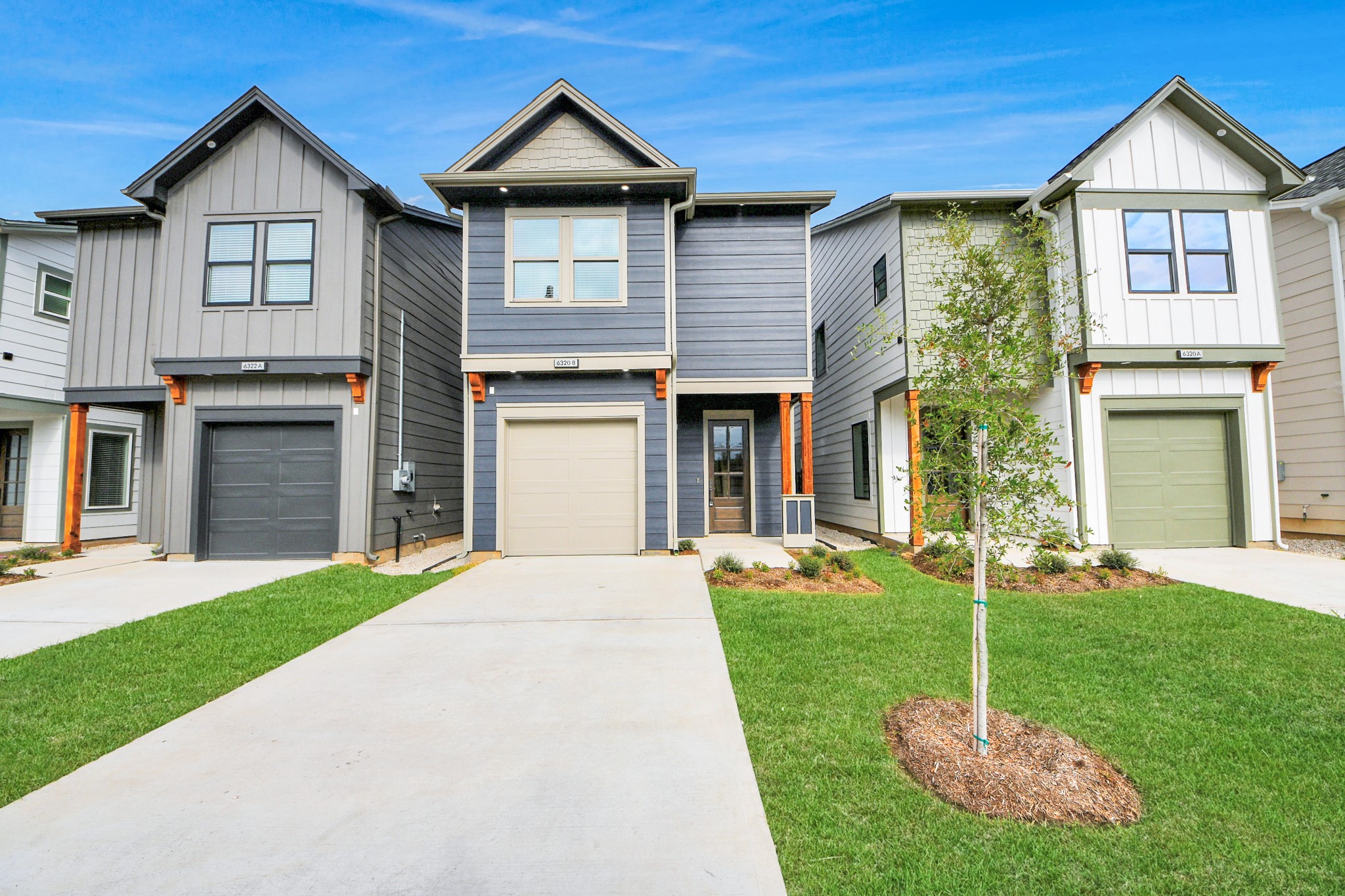 6320 Milwee Street, Unit B Houston, TX 77092 - Photo 5 of 43 a front view of a house with a yard and garage