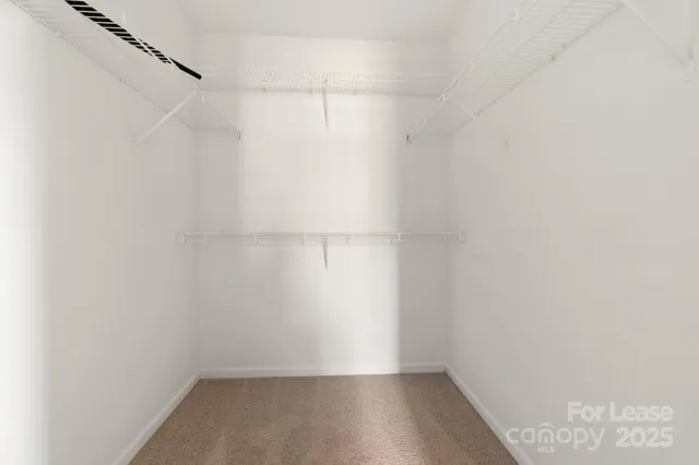 a view of an empty walk in closet