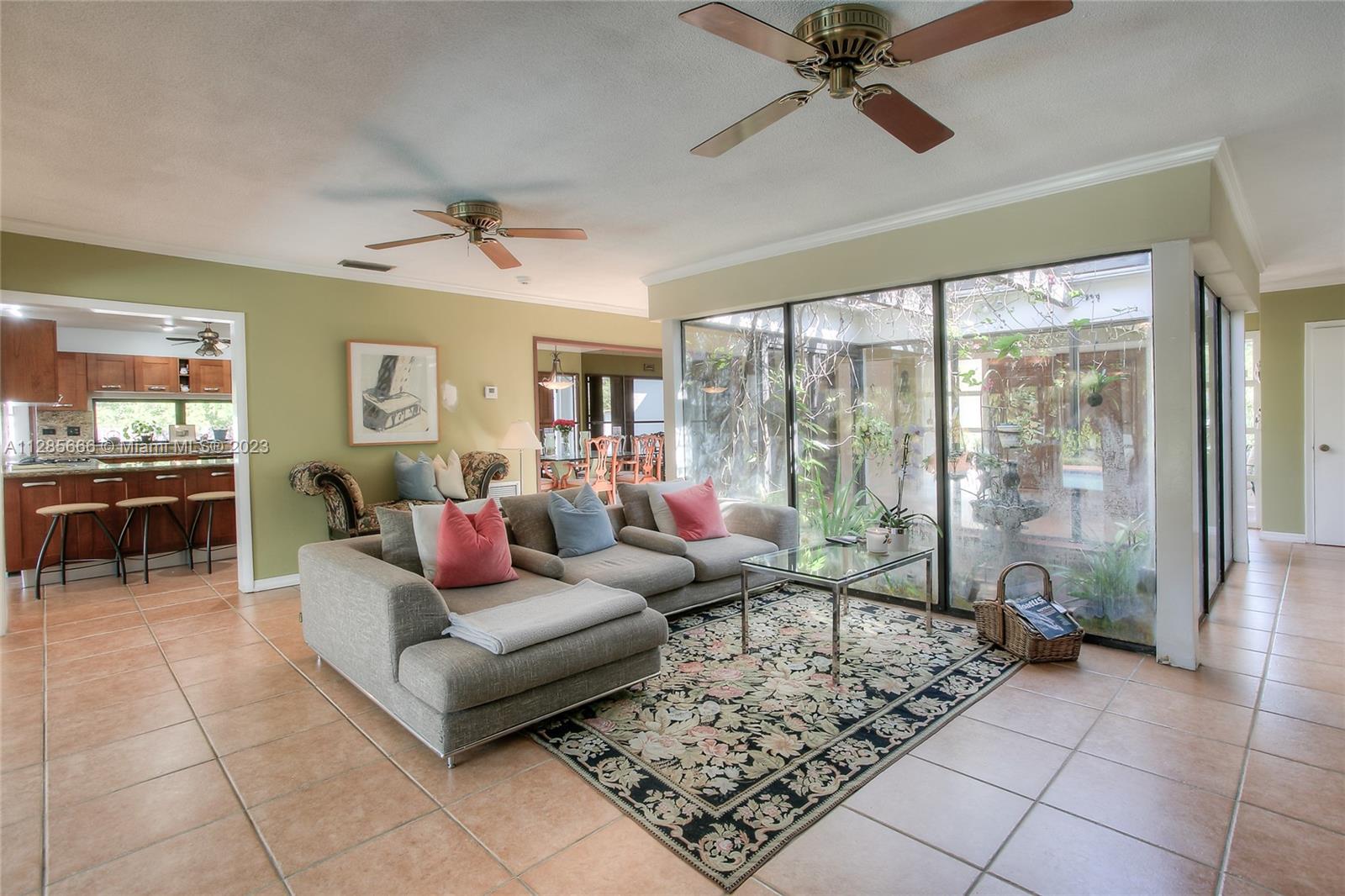 9670 Southwest 96th Court Miami, FL 33176 - Photo 11 of 21 a living room with furniture and a large window