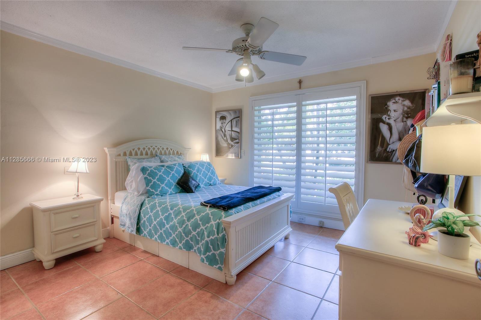 9670 Southwest 96th Court Miami, FL 33176 - Photo 13 of 21 a bedroom with a bed a couch and dresser