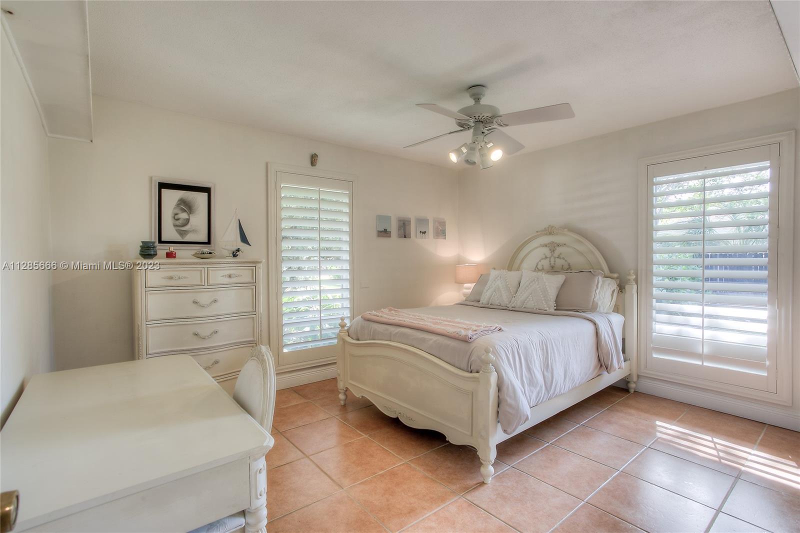 9670 Southwest 96th Court Miami, FL 33176 - Photo 15 of 21 a bedroom with a bed and a dresser