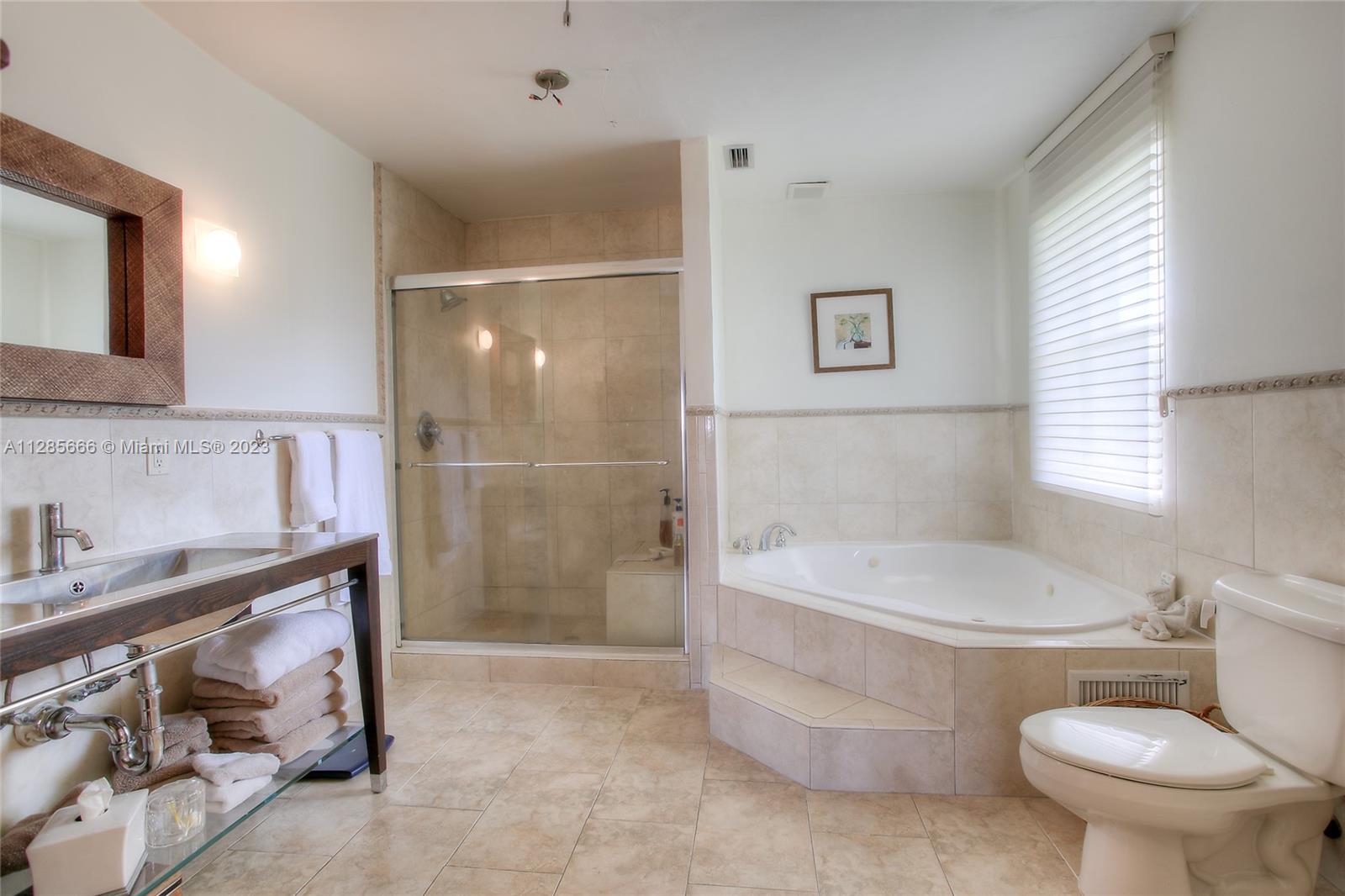 9670 Southwest 96th Court Miami, FL 33176 - Photo 17 of 21 a bathroom with a sink toilet and shower