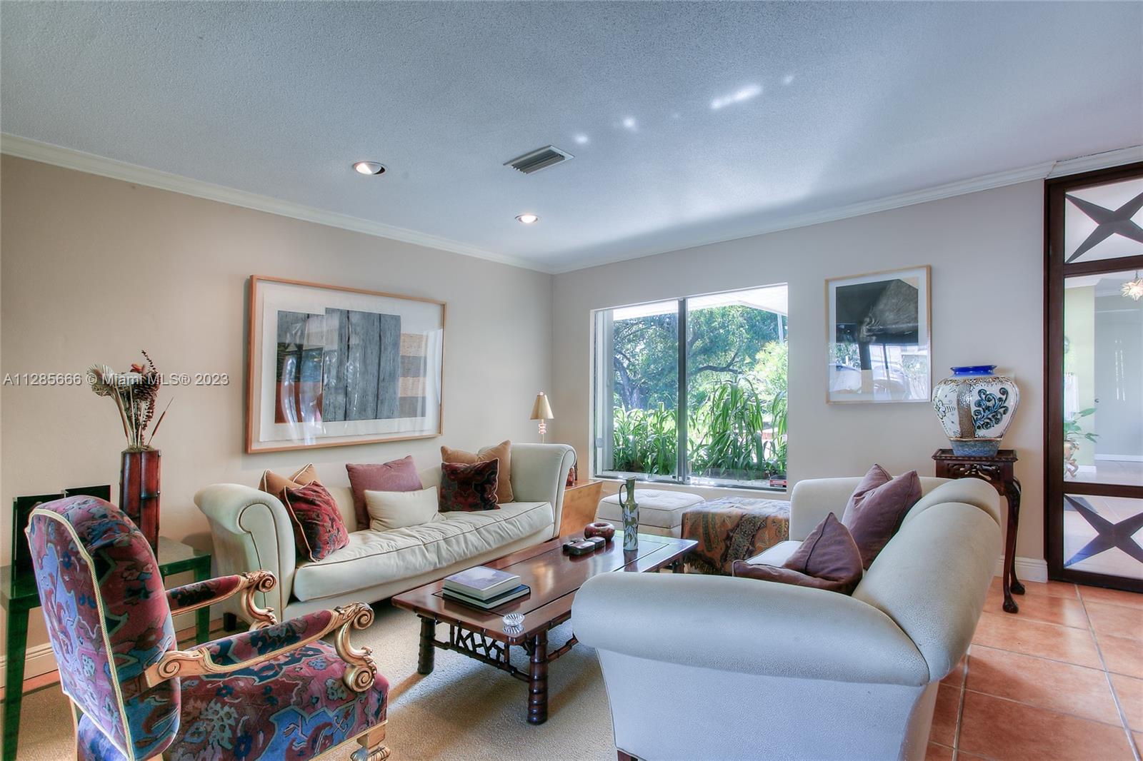 9670 Southwest 96th Court Miami, FL 33176 - Photo 4 of 21 a living room with furniture and a window