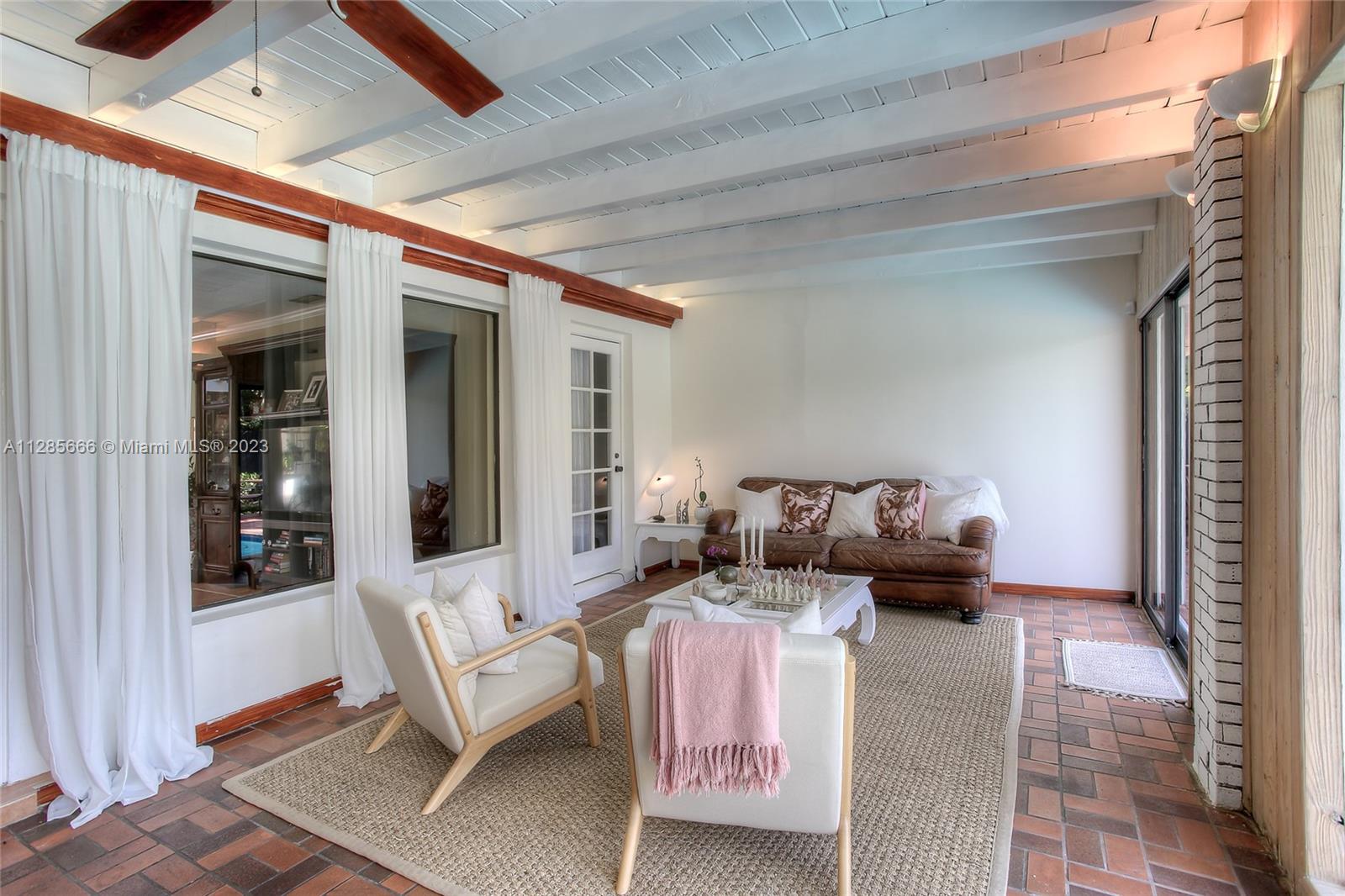 9670 Southwest 96th Court Miami, FL 33176 - Photo 7 of 21 a living room with furniture and a potted plant