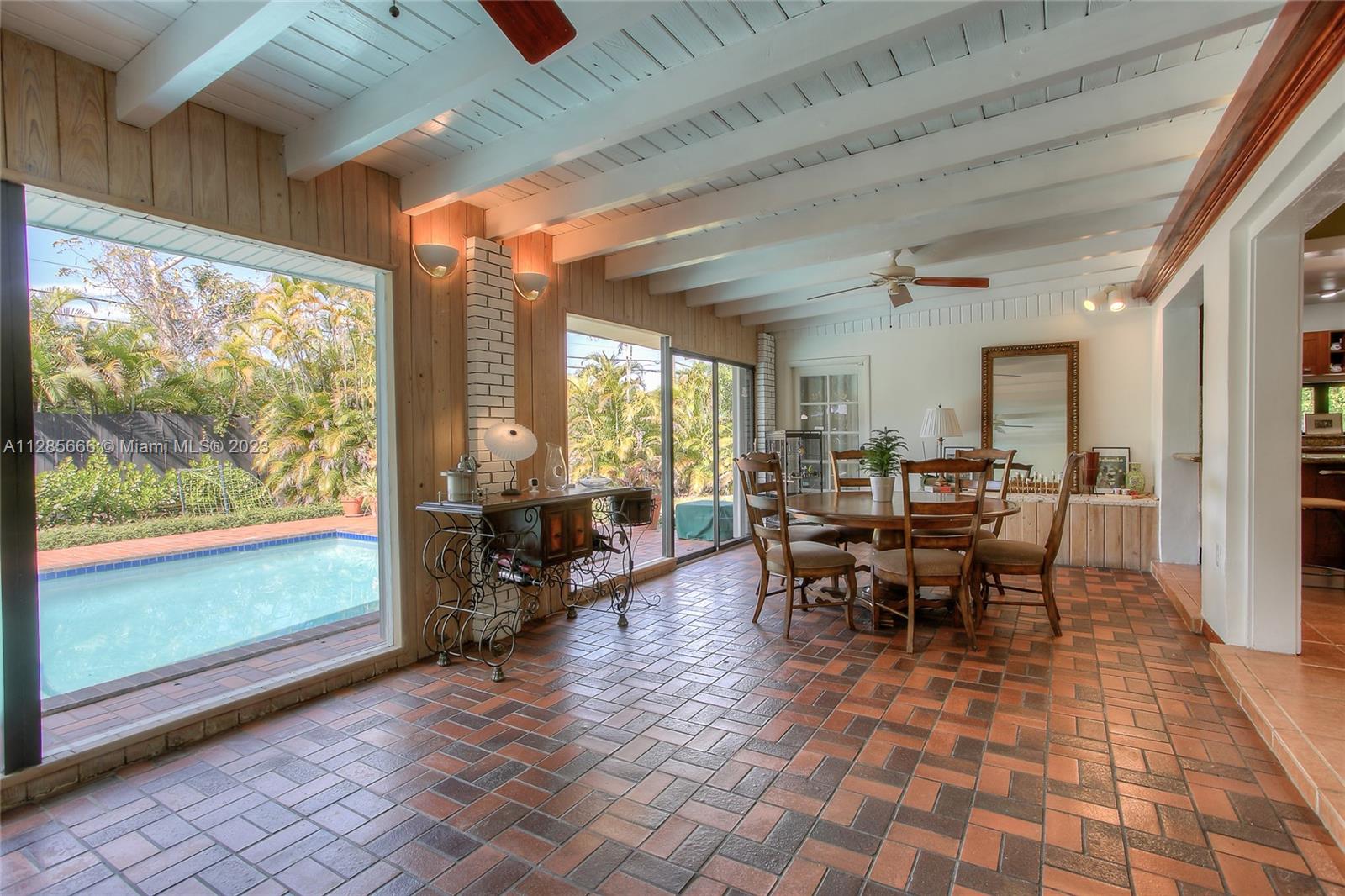 9670 Southwest 96th Court Miami, FL 33176 - Photo 9 of 21 a view of a dining room with furniture window and outside view
