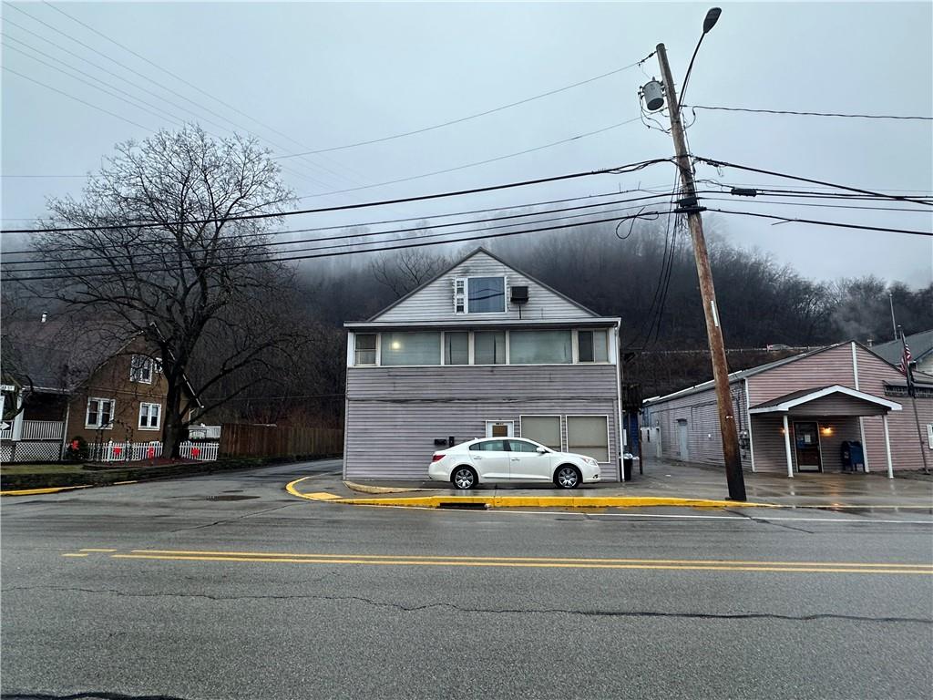 1023-1027 Freeport Road Creighton, PA 15030 - Photo 2 of 12 a front view of a house with a yard