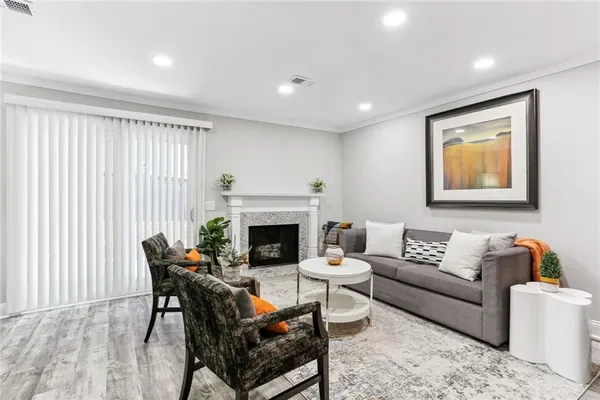 a living room with furniture and a fireplace