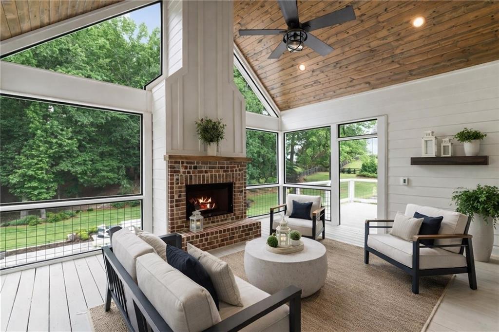 3511 Reavis Mountain Road, Unit 2 Ball Ground, GA 30107 - Photo 5 of 14 a living room with furniture and a fireplace