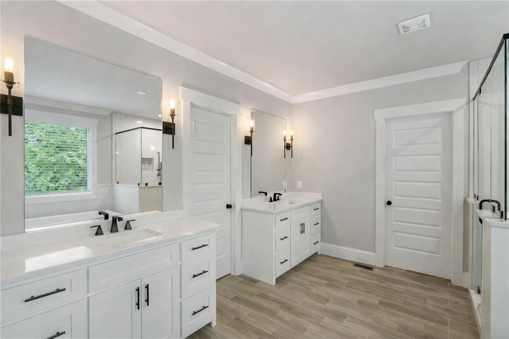 3511 Reavis Mountain Road, Unit 2 Ball Ground, GA 30107 - Photo 6 of 14 a spacious bathroom with double sink and a large mirror