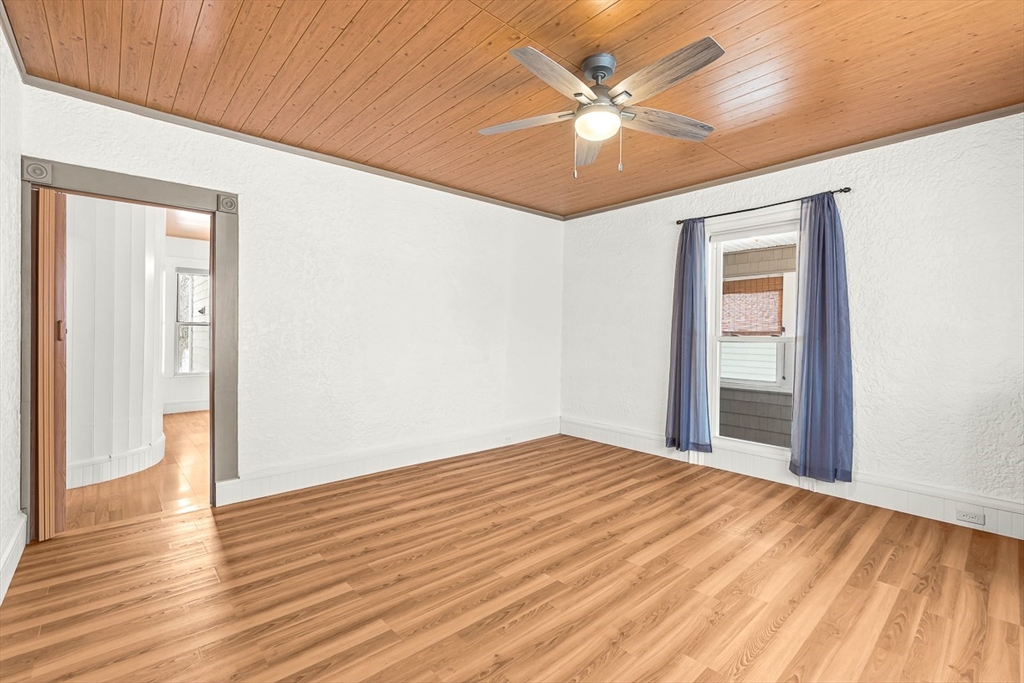 20 Pond Street Stoneham, MA 02180 - Photo 15 of 35 wooden floor in an empty room with a window